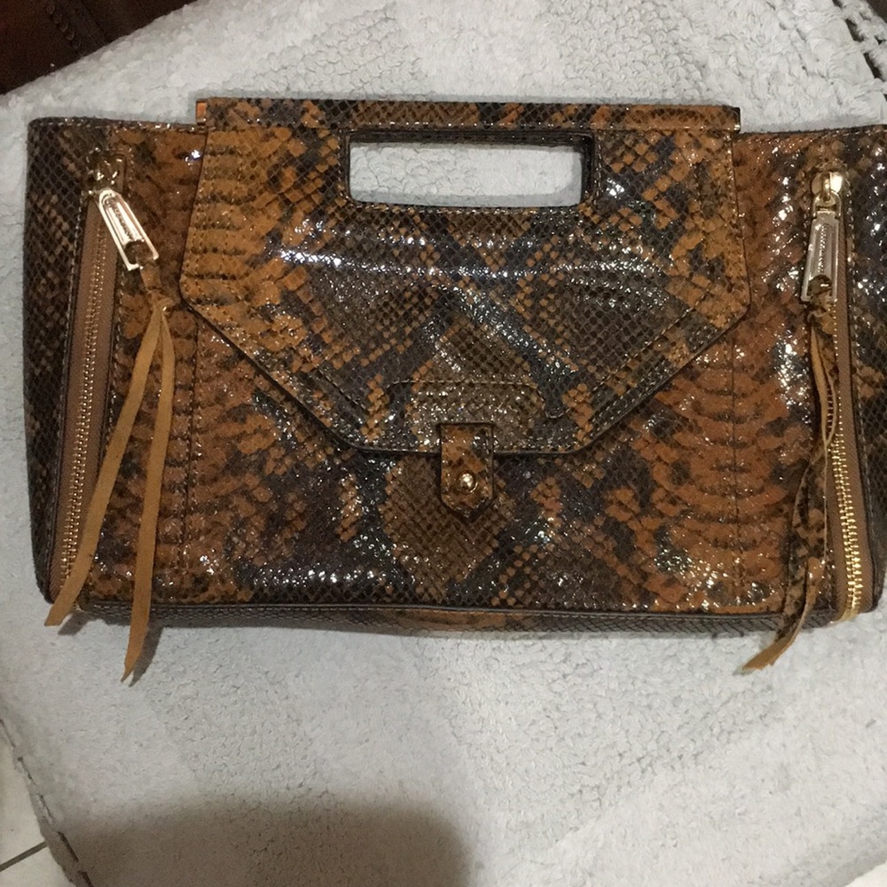 Rebecca Minkoff NWOT leather clutch. Genuine leather has magnetic closure.